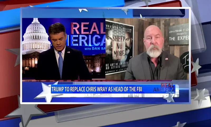 Video still from Real America on One America News Network showing a split screen of the host on the left side, and on the right side is the guest, Jonathan Gilliam.