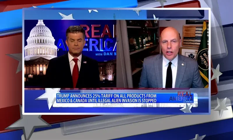 Video still from Real America on One America News Network showing a split screen of the host on the left side, and on the right side is the guest, Ron Vitiello.