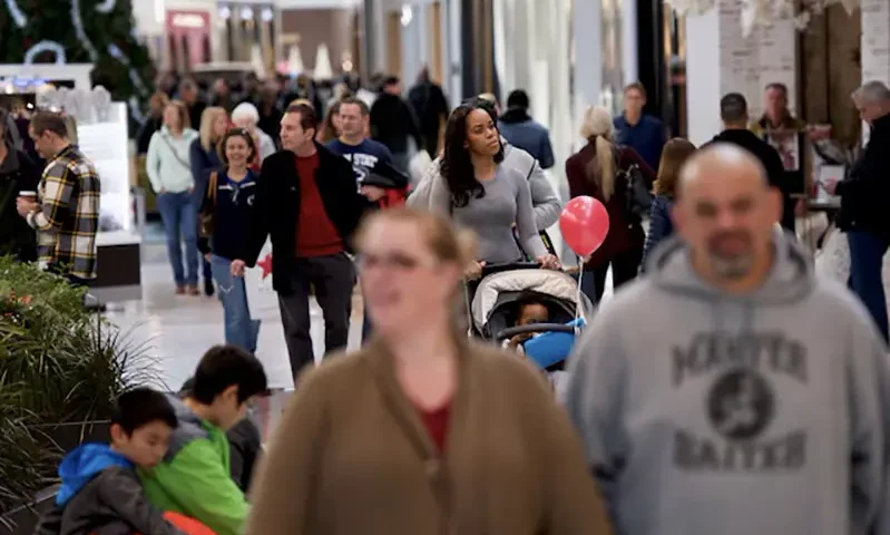 Shoppers walk through the King of Prussia Mall, United States' largest retail shopping space, in King of Prussia, Pennsylvania, U.S., December 8, 2018. REUTERS/Mark Makela/File Photo