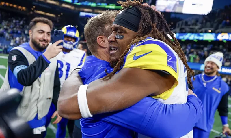 os Angeles Rams wide receiver Demarcus Robinson (15) celebrates with head coach Sean McVay, left, after catching a game-wining touchdown pass against the Seattle Seahawks during overtime at Lumen Field. Mandatory Credit: Joe Nicholson-Imagn Images