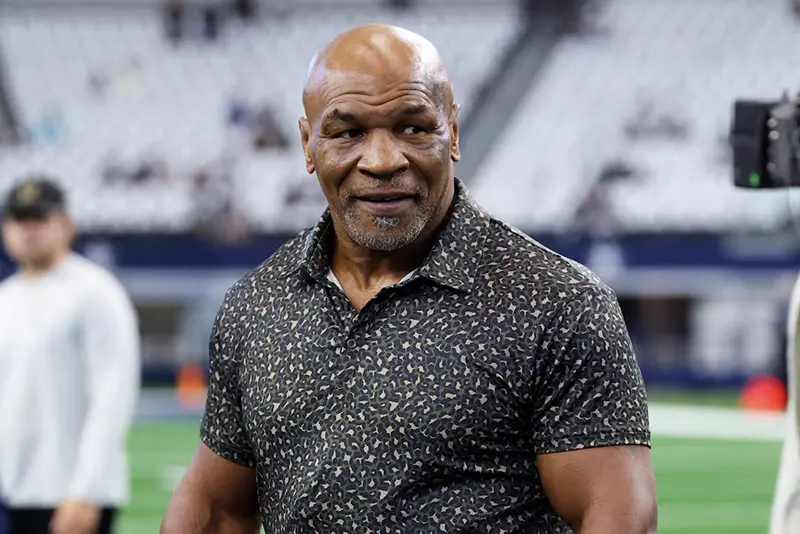 Boxer Mike Tyson on the field before the game between the Dallas Cowboys and New Orleans Saints at AT&T Stadium. Mandatory Credit: Kevin Jairaj-Imagn Images/File Photo