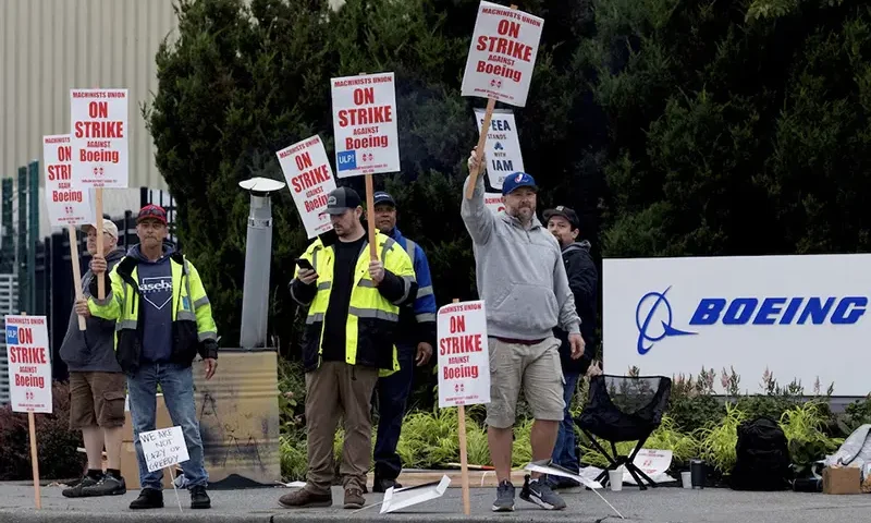 Boeing factory workers gather on a picket line during the first day of a strike near the entrance of a production facility in Renton, Washington, U.S., September 13, 2024. REUTERS/Matt Mills McKnight/File Photo