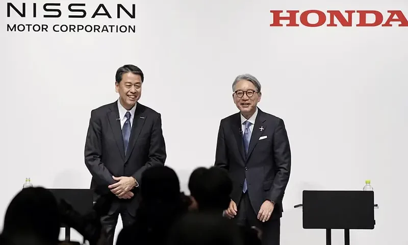 Makoto Uchida, president and CEO of Nissan Motor, and Toshihiro Mibe, Honda Motor president and CEO, attend their joint press conference in Tokyo, Japan March 15, 2024. Mandatory credit Kyodo/via REUTERS/File Photo