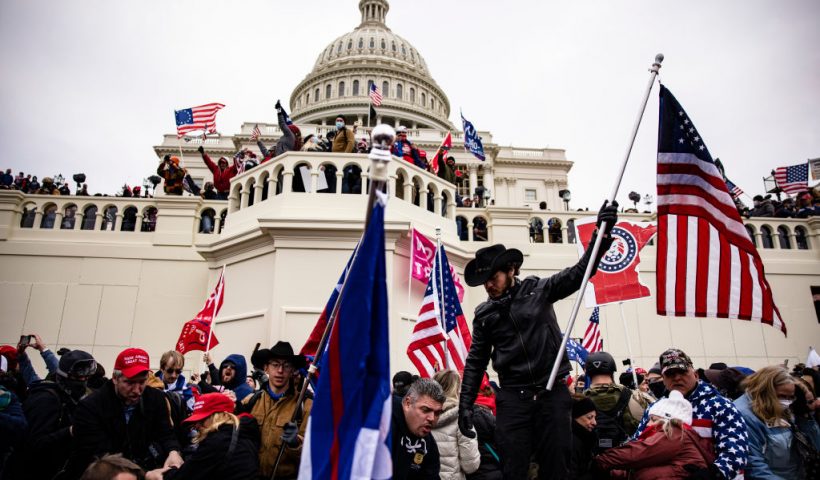 WASHINGTON, DC - JANUARY 06: Pro-Trump supporters storm the U.S. Capitol following a rally with President Donald Trump on January 6, 2021 in Washington, DC. Trump supporters gathered in the nation's capital today to protest the ratification of President-elect Joe Biden's Electoral College victory over President Trump in the 2020 election. (Photo by Samuel Corum/Getty Images)