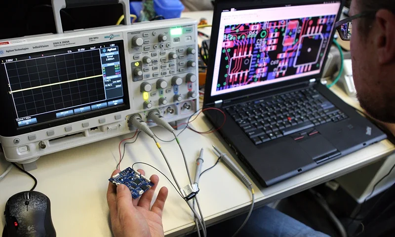 BERLIN, GERMANY - DECEMBER 27: A particpant checks a circuit board next to an oscilloscope on the first day of the 28th Chaos Communication Congress (28C3) - Behind Enemy Lines computer hacker conference on December 27, 2011 in Berlin, Germany. The Chaos Computer Club is Europe's biggest network of computer hackers and its annual congress draws up to 3,000 participants. (Photo by Adam Berry/Getty Images)