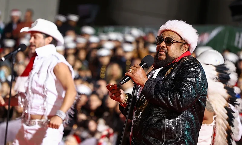 HOLLYWOOD, CALIFORNIA - NOVEMBER 26: (L-R) Nicholas Manelick and Victor Willis perform during the 91st anniversary of the Hollywood Christmas Parade, supporting Marine Toys For Tots on November 26, 2023 in Hollywood, California. (Photo by Tommaso Boddi/Getty Images for Associated Television International)