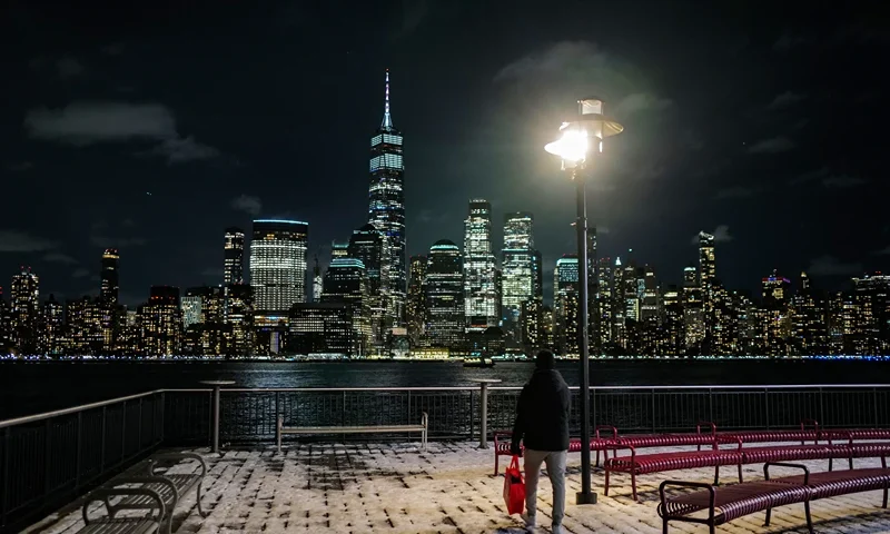 TOPSHOT - Night view of New York city's lower Manhattan skyline, with the One World Trade Center skyscraper (center left), seen from Jersey City on January 20, 2024. (Photo by Charly TRIBALLEAU / AFP) (Photo by CHARLY TRIBALLEAU/AFP via Getty Images)