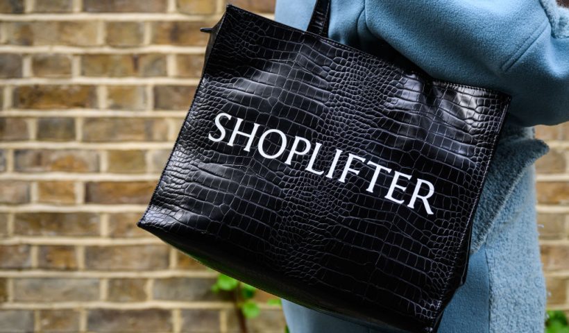 LONDON, ENGLAND - APRIL 10: A woman wears a bag on her shoulder, reading "SHOPLIFTER" on April 10, 2024 in London, England. The Government has announced new plans to crackdown on shoplifting including investment in facial recognition systems and higher penalties for those assaulting retail workers. (Photo by Leon Neal/Getty Images)