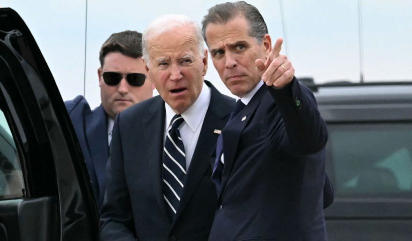 TOPSHOT - US President Joe Biden talks with his son Hunter Biden upon arrival at Delaware Air National Guard Base in New Castle, Delaware, on June 11, 2024, as he travels to Wilmington, Delaware. A jury found Hunter Biden guilty on June 11 on federal gun charges in a historic first criminal prosecution of the child of a sitting US president. The 54-year-old son of President Joe Biden was convicted on all three of the federal charges facing him, CNN and other US media reported. (Photo by ANDREW CABALLERO-REYNOLDS / AFP) (Photo by ANDREW CABALLERO-REYNOLDS/AFP via Getty Images)