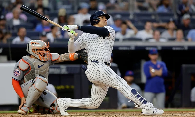 NEW YORK, NEW YORK - JULY 24: Juan Soto #22 of the New York Yankees follows through on his home run in the third inning against the New York Mets at Yankee Stadium on July 24, 2024 in New York City. (Photo by Jim McIsaac/Getty Images)