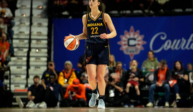 UNCASVILLE, CONNECTICUT - SEPTEMBER 22: Caitlin Clark #22 of the Indiana Fever advances the ball during the second half of a first-round WNBA playoff game against the Connecticut Sun at Mohegan Sun Arena on September 22, 2024 in Uncasville, Connecticut. The Sun defeated the Fever 93-69. NOTE TO USER: User expressly acknowledges and agrees that, by downloading and or using this photograph, User is consenting to the terms and conditions of the Getty Images License Agreement. (Photo by Joe Buglewicz/Getty Images)