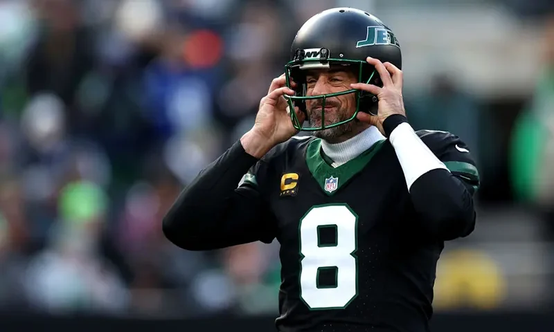 Aaron Rodgers #8 of the New York Jets puts on his helmet against the Seattle Seahawks during the first quarter at MetLife Stadium on December 01, 2024 in East Rutherford, New Jersey. (Photo by Luke Hales/Getty Images)