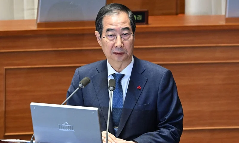 South Korean Prime Minister Han Duck-soo attends a plenary session, where a question-and-answer session was held relating to the martial law declaration, at the National Assembly in Seoul on December 11, 2024. South Korean police raided President Yoon Suk Yeol's office on December 11 as the investigation into his declaration of martial law gathered pace. (Photo by JUNG YEON-JE / AFP) (Photo by JUNG YEON-JE/AFP via Getty Images)