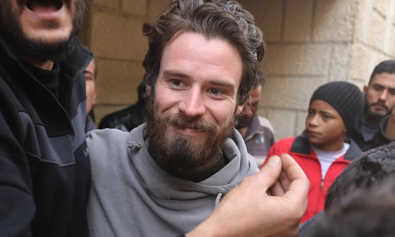 Travis Timmerman, a US citizen who had entered Syria from Lebanon on a Christian pilgrimage and had been detained for several months, speaks with reporters in a house in Damascus on December 12, 2024, after he was found in the village of Thihabiyeh east of the capital, after rebels toppled longtime president Bashar al-Assad. (Photo by Abdulaziz KETAZ / AFP) (Photo by ABDULAZIZ KETAZ/AFP via Getty Images)