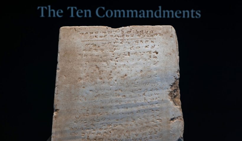 NEW YORK, NEW YORK - DECEMBER 09: The oldest known stone tablet inscribed with the Ten Commandments, dating from 300 to 800 A.D., is displayed at Sotheby's auction house on December 09, 2024 in New York City. The tablet will be sold in New York later this this month and is expected to be auctioned for $1 million to $2 million. Inscribed with the commandments in Paleo-Hebrew script, the tablet was discovered during railroad excavations along the southern coast of Israel in 1913. (Photo by Spencer Platt/Getty Images)