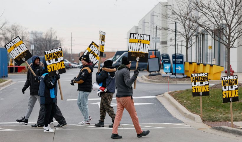 Amazon delivery drivers walk the picket line outside Amazon delivery station as they went on strike in Skokie, Illinois on December 19 2024. Thousands of workers at Amazon facilities across the United States went on strike Thursday, the Teamsters Union said, halting work at the height of the busy holiday gift-giving season. (Photo by KAMIL KRZACZYNSKI / AFP) (Photo by KAMIL KRZACZYNSKI/AFP via Getty Images)