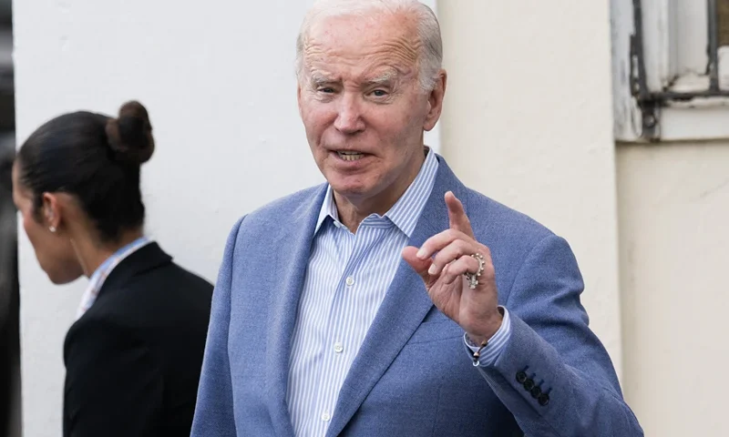 US President Joe Biden answers a question from the press as he exits Holy Cross Catholic Church after attending mass in Christiansted, St. Croix, on the US Virgin Islands, on December 28, 2024, during a week-long vacation on the island. (Photo by SAUL LOEB / AFP) (Photo by SAUL LOEB/AFP via Getty Images)