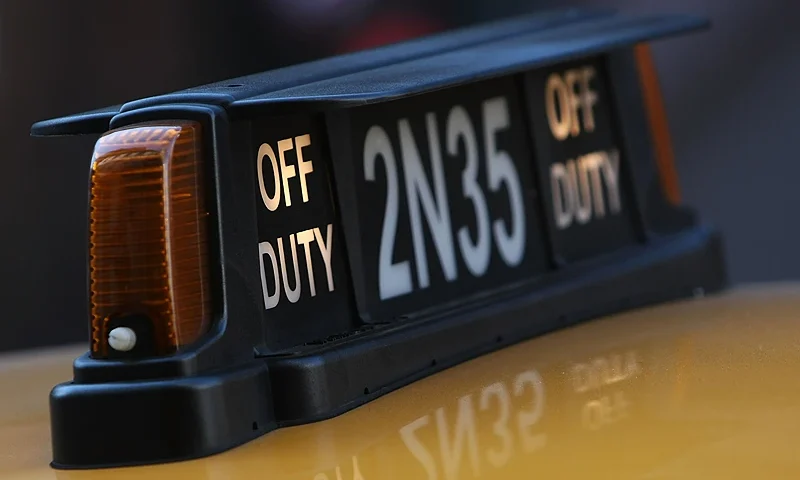NEW YORK - OCTOBER 22: A taxi sign is seen October 22, 2007 in New York City. Some city taxi drivers went on 24-hour strike today protesting the installation of GPS tracking systems and credit card machines. (Photo by Mario Tama/Getty Images)