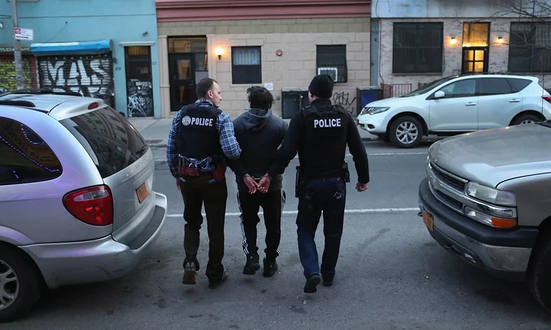 NEW YORK, NY - APRIL 11: U.S. Immigration and Customs Enforcement (ICE), officers arrest an undocumented Mexican immigrant during a raid in the Bushwick neighborhood of Brooklyn on April 11, 2018 in New York City. New York is considered a "sanctuary city" for undocumented immigrants, and ICE receives little or no cooperation from local law enforcement. ICE said that officers arrested 225 people for violation of immigration laws during the 6-day operation, the largest in New York City in recent years. (Photo by John Moore/Getty Images)