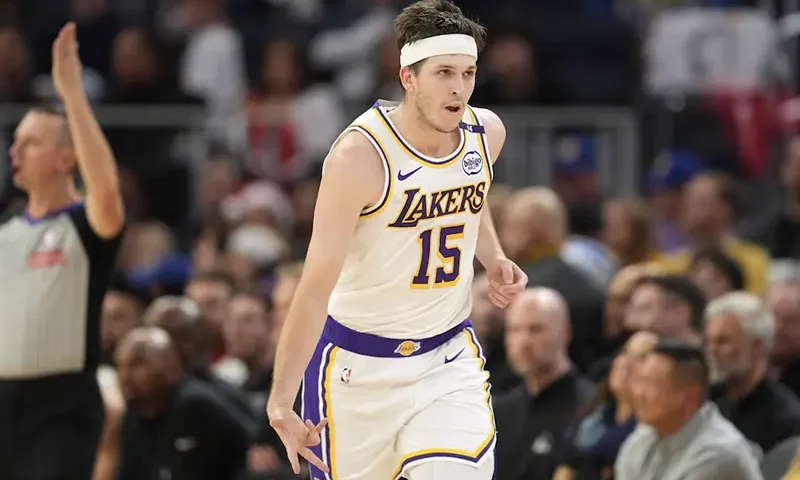 Los Angeles Lakers guard Austin Reaves (15) gestures after making a three point basket against the Golden State Warriors during the third quarter at Chase Center. Mandatory Credit: Darren Yamashita-Imagn Images