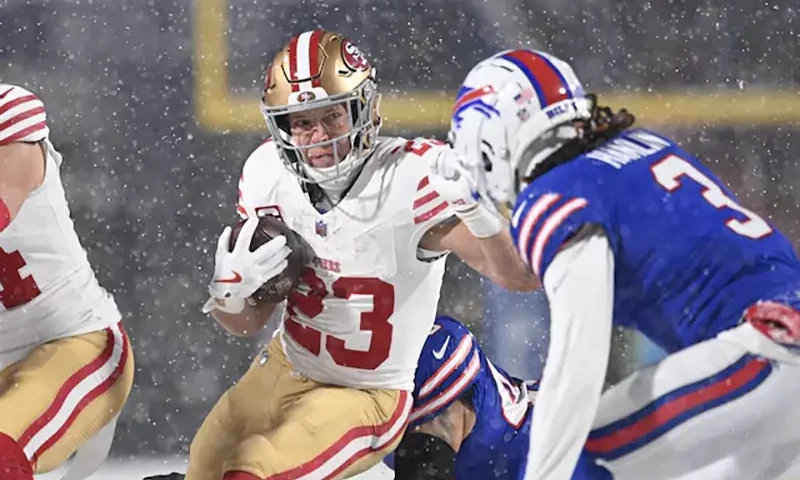 San Francisco 49ers running back Christian McCaffrey (23) tries to avoid Buffalo Bills safety Damar Hamlin (3) on a run in the first quarter at Highmark Stadium. Mandatory Credit: Mark Konezny-Imagn Images/ File Photo