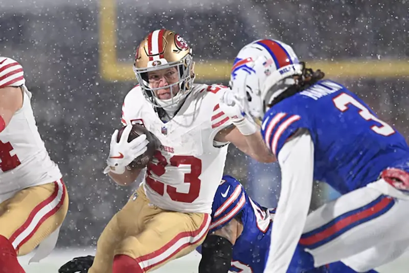 San Francisco 49ers running back Christian McCaffrey (23) tries to avoid Buffalo Bills safety Damar Hamlin (3) on a run in the first quarter at Highmark Stadium. Mandatory Credit: Mark Konezny-Imagn Images/ File Photo