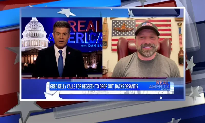 Video still from Real America on One America News Network showing a split screen of the host on the left side, and on the right side is the guest, Chad Robichaux.
