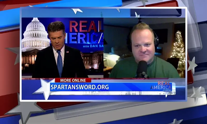Video still from Real America on One America News Network showing a split screen of the host on the left side, and on the right side is the guest, Chad Caton.
