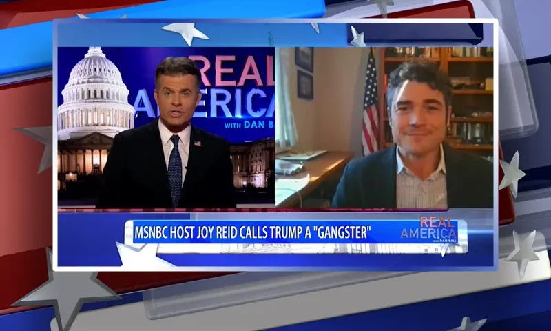 Video still from Real America on One America News Network showing a split screen of the host on the left side, and on the right side is the guest, Joe Kent.