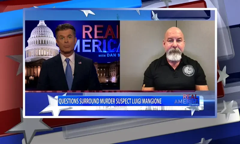 Video still from Real America on One America News Network showing a split screen of the host on the left side, and on the right side is the guest, Jonathan Giliam.