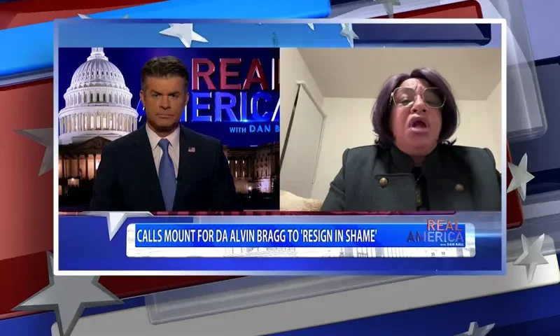 Video still from Real America on One America News Network showing a split screen of the host on the left side, and on the right side is the guest, Madeline Brame.