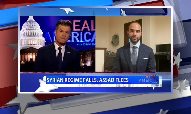 Video still from Real America on One America News Network showing a split screen of the host on the left side, and on the right side is the guest, George Papadopoulos.