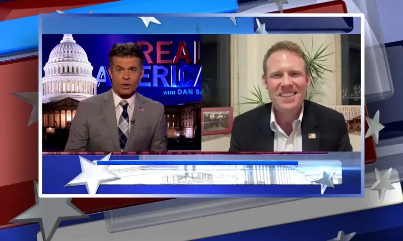 Video still from Real America on One America News Network showing a split screen of the host on the left side, and on the right side is the guest, Andrew Giuliani.