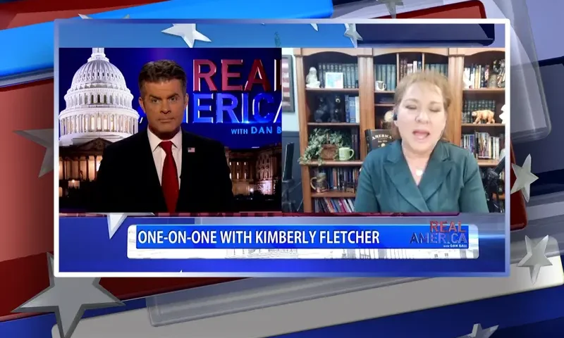 Video still from Real America on One America News Network showing a split screen of the host on the left side, and on the right side is the guest, Kimberly Fletcher.