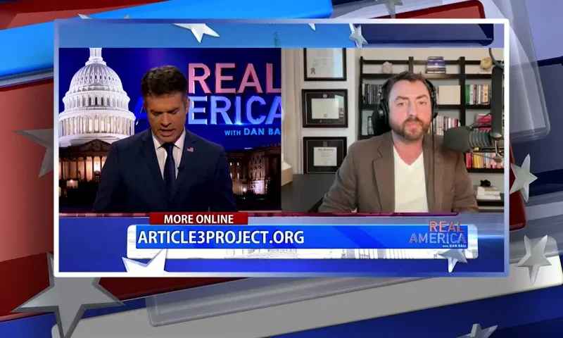 Video still from Real America on One America News Network showing a split screen of the host on the left side, and on the right side is the guest, Josh Hammer.