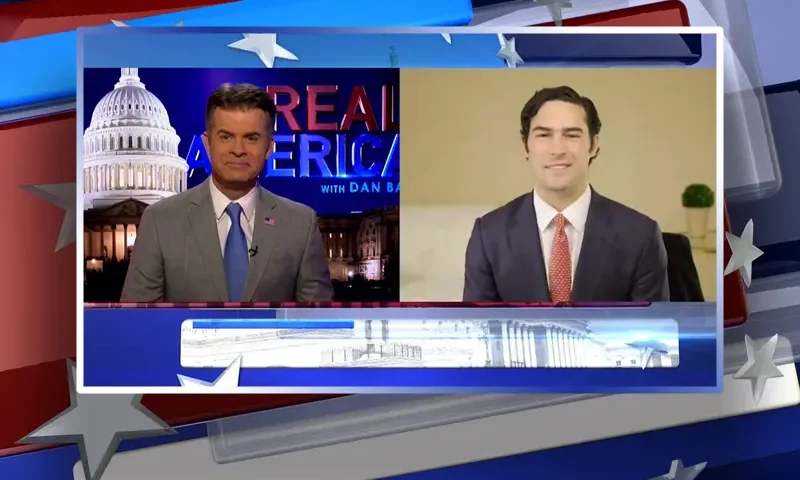 Video still from Real America on One America News Network showing a split screen of the host on the left side, and on the right side is the guest, Congressman-Elect Brandon Gill.