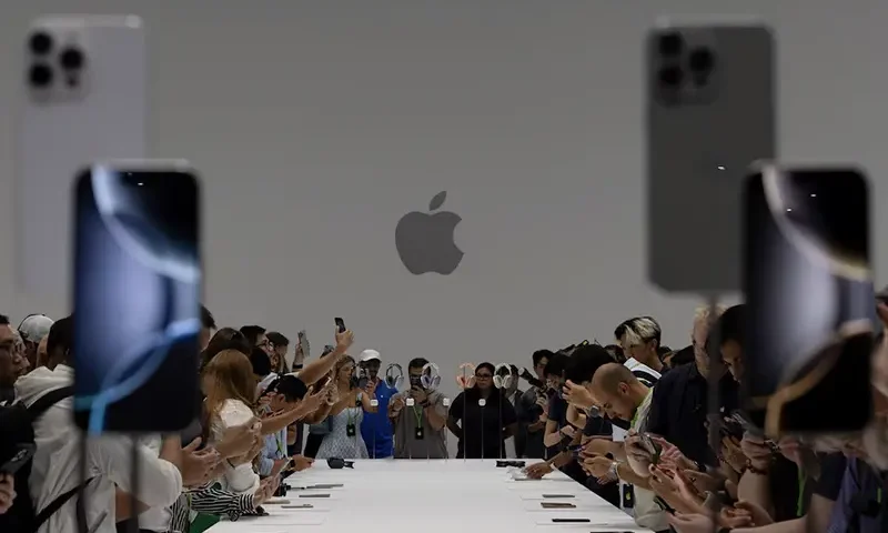 Attendees test the iPhone 16 Pro as Apple holds an event at the Steve Jobs Theater on its campus in Cupertino, California, U.S. September 9, 2024. REUTERS/Manuel Orbegozo/File Photo