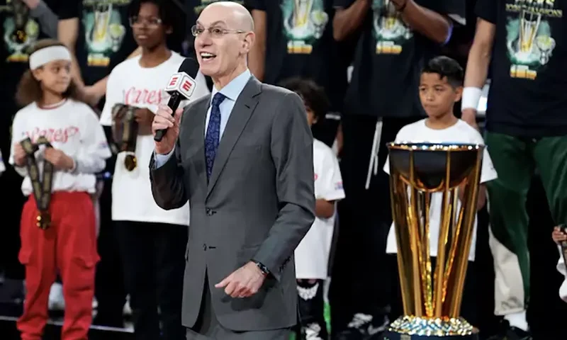 NBA commissioner Adam Silver presents the trophy to the Milwaukee Bucks after they won the Emirates NBA Cup championship game against the Oklahoma City Thunder at T-Mobile Arena. Mandatory Credit: Kyle Terada-Imagn Images/File Photo