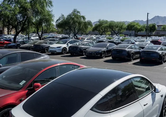 Tesla electric vehicles are parked in a storage lot outside a disused movie theatre in Scottsdale, Arizona, U.S., June 11, 2024. REUTERS/Go Nakamura/File Photo
