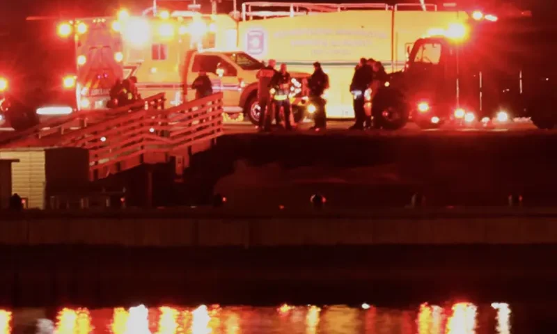 Emergency personnel work near the site of the crash after American Eagle flight 5342 collided with a Black Hawk helicopter while approaching Reagan Washington National Airport and crashed into the Potomac River, outside Washington, U.S., January 30, 2025. REUTERS/Carlos Barria