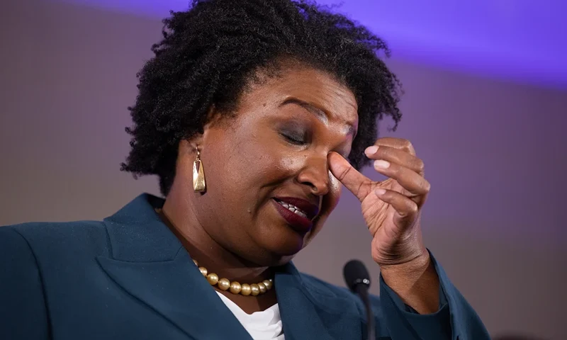 ATLANTA, GA - NOVEMBER 08: Democratic gubernatorial candidate Stacey Abrams wipes her eye during a concession speech to supporters during an election-night party on November 8, 2022 in Atlanta, Georgia. Abrams lost her bid for governor to incumbent Gov. Brian Kemp in a rematch of their 2018 race. (Photo by Jessica McGowan/Getty Images)