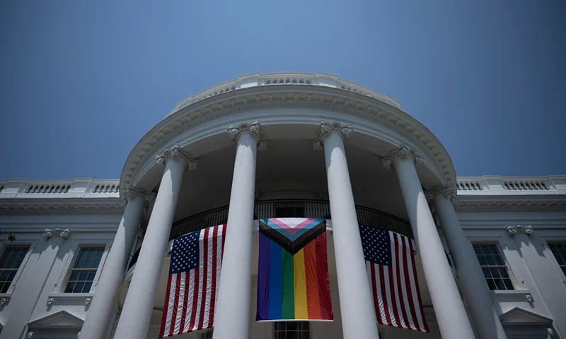 TOPSHOT - A Pride flag is displayed during a Pride celebration on the South Lawn of the White House in Washington, DC, on June 10, 2023. (Photo by Brendan Smialowski / AFP) (Photo by BRENDAN SMIALOWSKI/AFP via Getty Images)