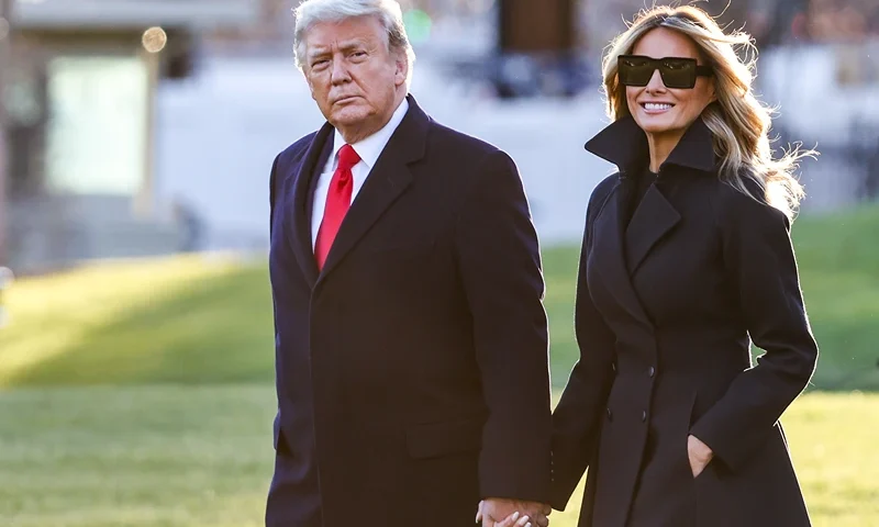WASHINGTON, DC - DECEMBER 23: President Donald Trump and first lady Melania Trump walk on the south lawn of the White House on December 23, 2020 in Washington, DC. The Trumps are headed to Mar-a-Lago for the holidays with a government shutdown possible on Monday December 28. (Photo by Tasos Katopodis/Getty Images)