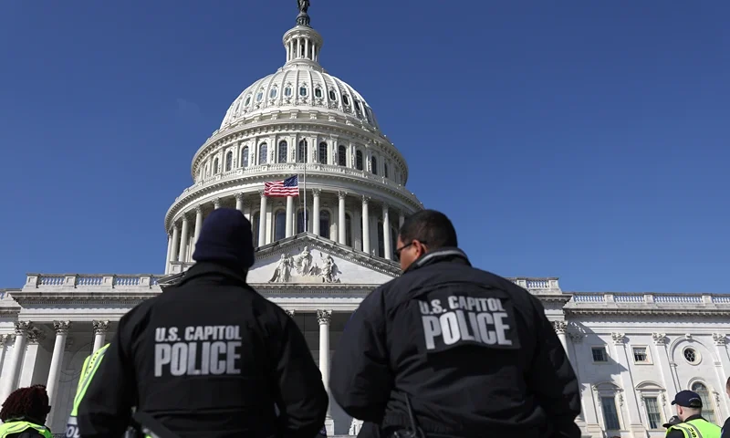 F U.S. Capitol police officers gather on the east front plaza of the Capitol on February 28, 2022 in Washington, DC. Security has been heightened and fencing was erected around the U.S. Capitol ahead of U.S. President Joe Biden's State of the Union address on Tuesday evening. (Photo by Justin Sullivan/Getty Images)