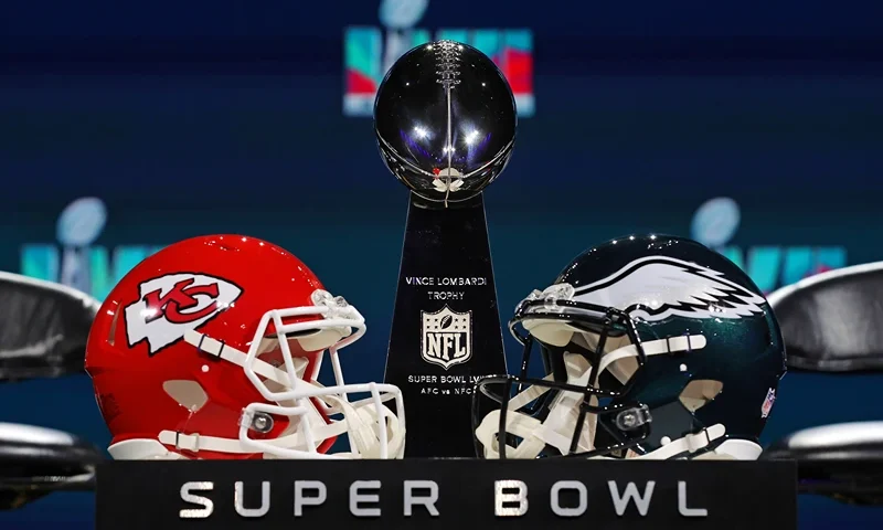 PHOENIX, ARIZONA - FEBRUARY 08: A view of the Vince Lombardi Trophy and the helmets of the Kansas City Chiefs and the Philadelphia Eagles before a press conference for NFL Commissioner Roger Goodell at Phoenix Convention Center on February 08, 2023 in Phoenix, Arizona. (Photo by Peter Casey/Getty Images)