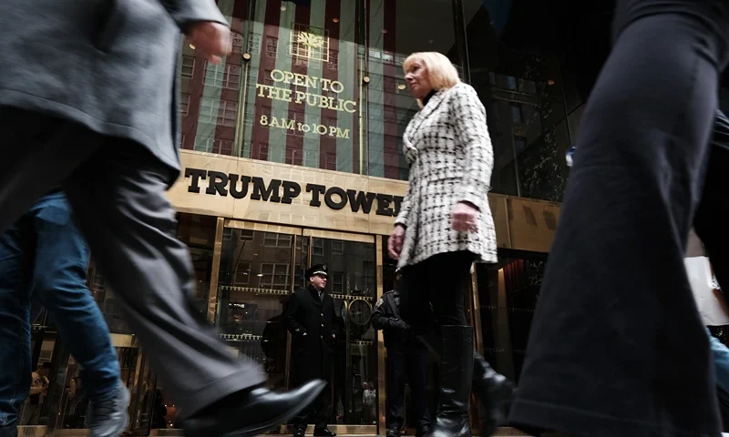 NEW YORK, NY - MARCH 31: People walk by Trump Tower the morning after former president Donald Trump was indicted by a New York jury on March 31, 2023 in New York City. Trump has been indicted for his role in a hush money scheme prior to the 2016 election. The vote to indict, which was brought by Manhattan District Attorney Alvin Bragg, suggests that a grand jury found probable cause that Trump committed an offense, which will now need to be proved to a jury. (Photo by Spencer Platt/Getty Images)