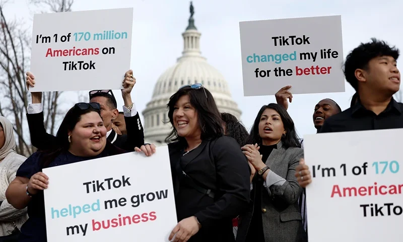 WASHINGTON, DC - MARCH 13: Participants hold signs in support of TikTok outside the U.S. Capitol Building on March 13, 2024 in Washington, DC. The House of Representatives will vote Wednesday on whether to ban TikTok in the United States due to concerns over personal privacy and national security unless the Chinese-owned parent company ByteDance sells the popular video app within the next six months. (Photo by Anna Moneymaker/Getty Images)