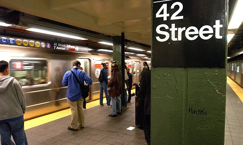 NEW YORK - JUNE 18: People wait for a train in a subway station June 18, 2003 in New York City. A new report by the New York Police Department (NYPD) reports that felonies are down 15 percent this year on New York's subways. The NYPD credits an increase in officers at subway stations for part of the drop in crime on trains and stations. (Photo by Spencer Platt/Getty Images)