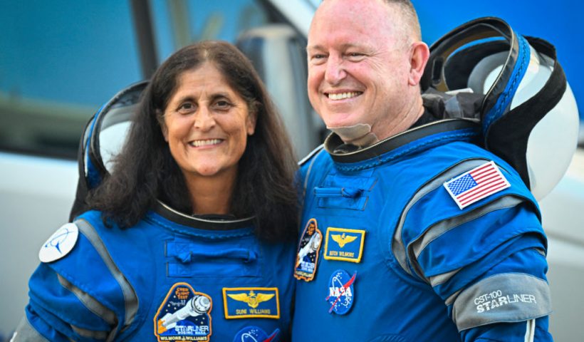 NASA astronauts Butch Wilmore (R) and Suni Williams, wearing Boeing spacesuits, depart the Neil A. Armstrong Operations and Checkout Building at Kennedy Space Center for Launch Complex 41 at Cape Canaveral Space Force Station in Florida to board the Boeing CST-100 Starliner spacecraft for the Crew Flight Test launch , on June 5, 2024. Boeing on June 5 will try once more to launch astronauts aboard a Starliner capsule bound for the International Space Station. Liftoff is targeted for 10:52 am (1452 GMT) for a roughly one-week stay at the orbital laboratory. (Photo by Miguel J. Rodriguez Carrillo / AFP) (Photo by MIGUEL J. RODRIGUEZ CARRILLO/AFP via Getty Images)