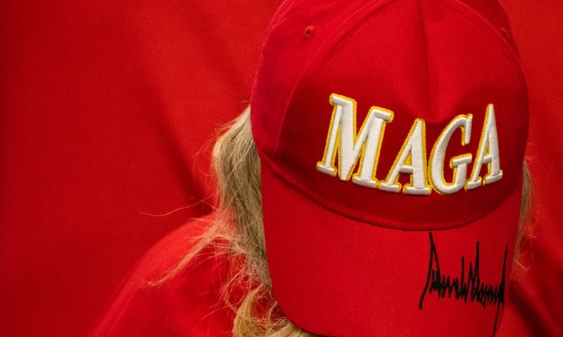 A supporter wears a signed MAGA hat as Former US President and 2024 Republican presidential candidate Donald Trump speaks at a campaign rally at the New Holland Arena in Harrisburg, Pennsylvania, on July 31, 2024. (Photo by Joe LAMBERTI / AFP) (Photo by JOE LAMBERTI/AFP via Getty Images)